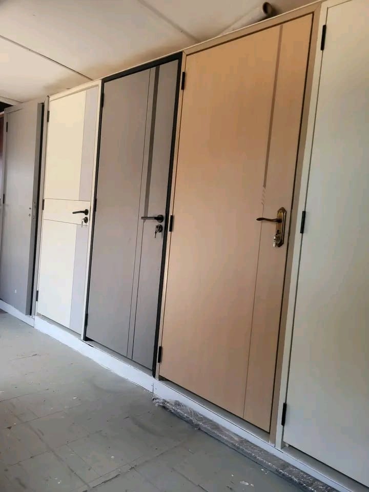 Flush doors on display in oak, grey and white finishes