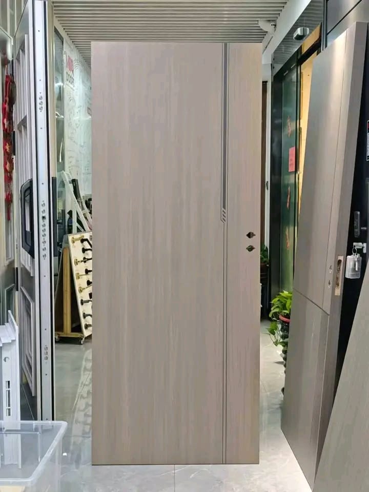 Grey woodgrain flush door with vertical groove on showroom display