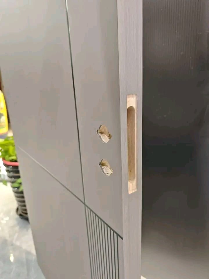 Close-up of lock and handle cutouts on a flush door leaf