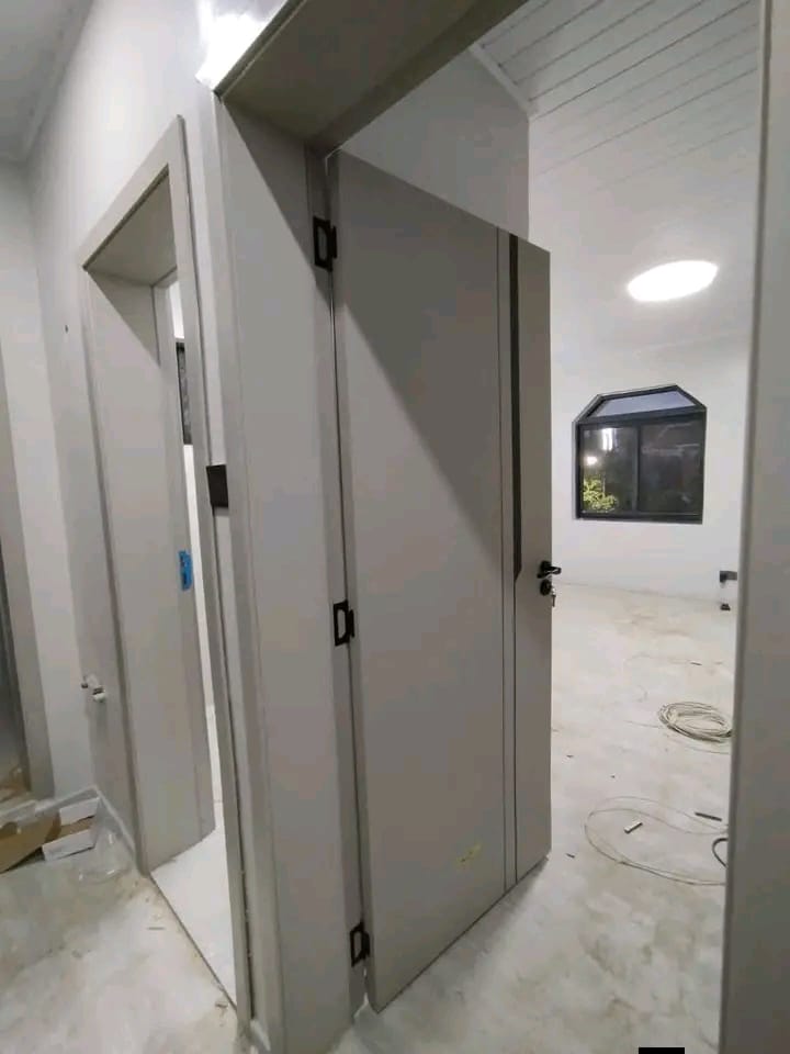 Grey flush doors installed throughout a new building