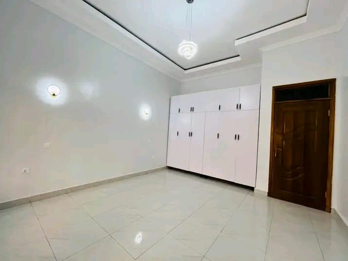 Large polished floor tiles laid in a bedroom