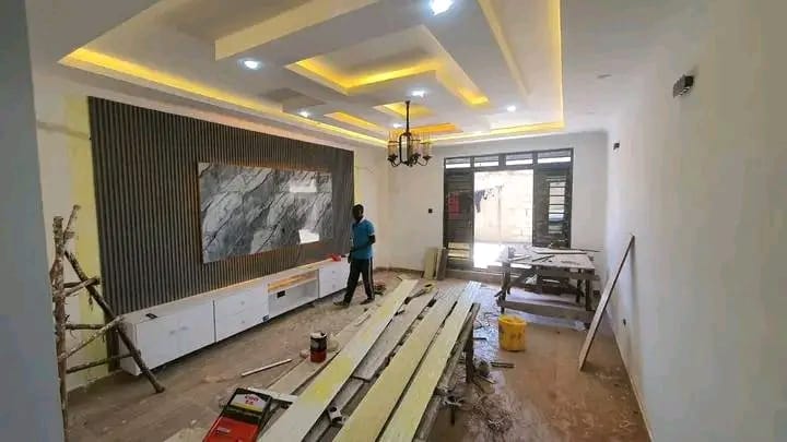 Wall panelling and TV unit with ceiling work in progress